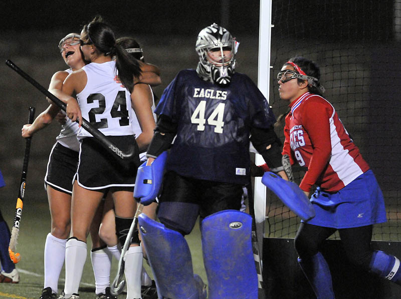 Staff photo by Michael G. Seamans Skowhegan High School's Rylie Blanchet, 24, celebrates with teammates after scoring against Messalonksee High School's Abigail Roberts, 44, right center and Natalie Hunt, 19, in the second half of the Eastern Class A championship game. Skowhegan defeated Messalonskee 2-1.