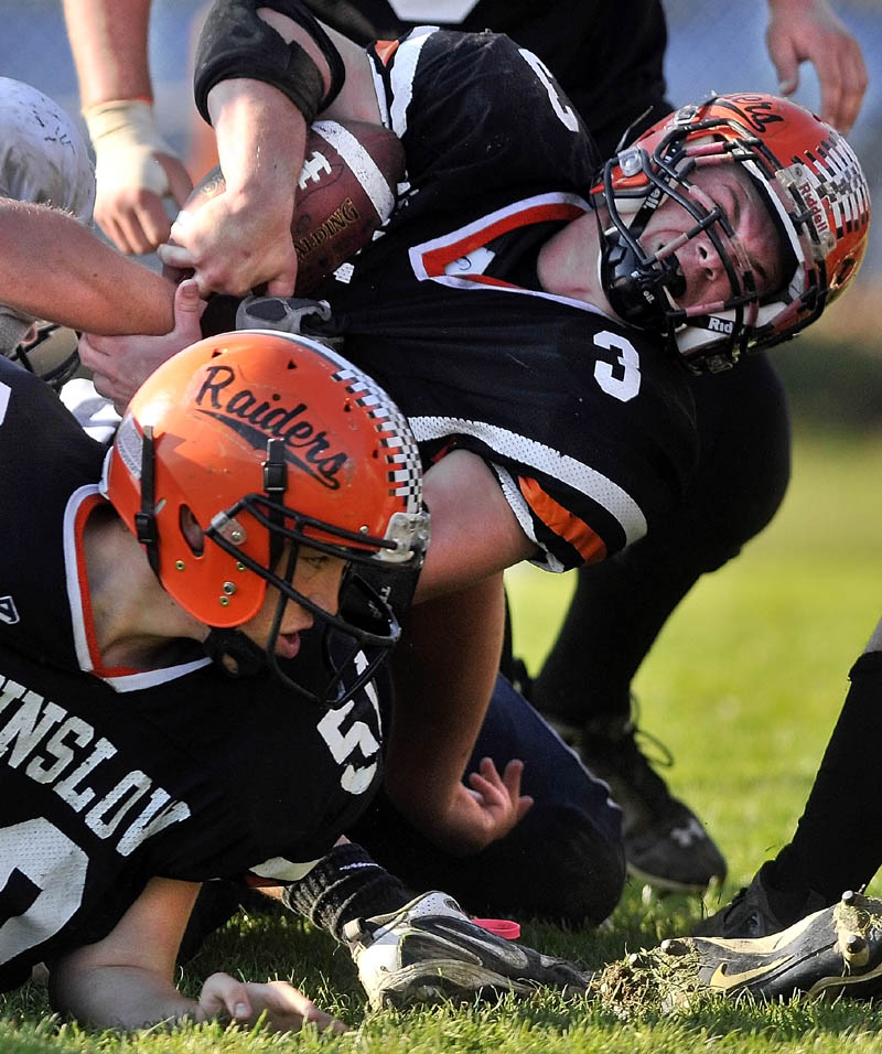 RUGGED RUN: Winslow High School running back Dylan Hapworth (3) muscles his way into the end zone during the Raiders’ 50-22 win over Yarmouth in a Campbell Conference Class C quarterfinal game Saturday.