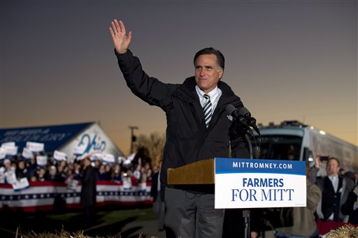 Republican presidential candidate Mitt Romney waves during a campaign rally at the Shelby County Fairgrounds on Wednesday in Sidney, Ohio.