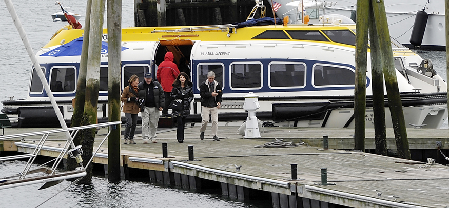 Condominium owners of The World disembark from a tender that carries owners to port from the moored ship just off Rockland Breakwater Lighthouse. They plan a couple of days in Rockland, then Portland and then off to Bermuda, according to a couple of owners who asked not to be identified for personal reasons.