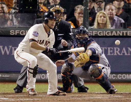 San Francisco Giants' Gregor Blanco bunts to load the bases during the seventh inning of Game 2 of baseball's World Series against the Detroit Tigers, Thursday, Oct. 25, 2012, in San Francisco. (AP Photo/Charlie Riedel) MLB