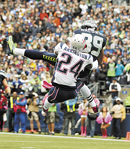 BAD DEFENSE: Seattle’s Doug Baldwin (89) makes a catch for a touchdown as New England cornerback Kyle Arrington (24) tries to defend Sunday in Seattle.
