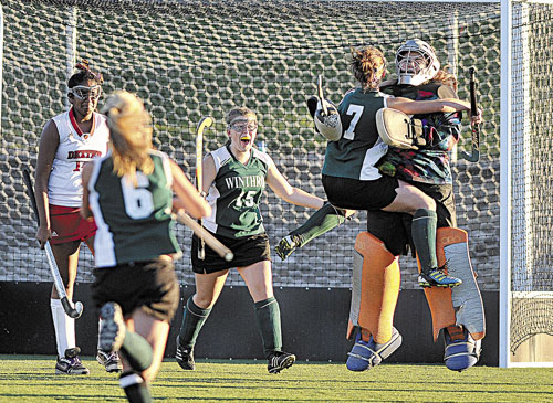BIG WIN: Winthrop celebrates its 1-0 victory over Dexter in the Eastern Class C championship game Tuesday in Hampden.