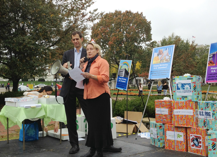 Melanie Collins, who runs Melanie’s Home Childcare in Falmouth, speaks at a rally near the White House on Friday. She was among speakers calling on the U.S. Chamber of Commerce to disclose the donors behind the Chamber’s political activities.