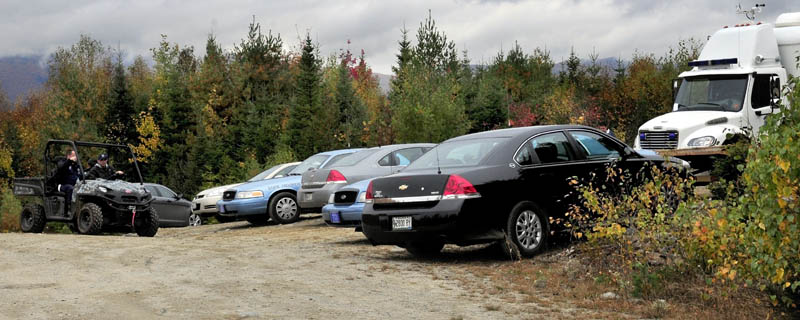 INVESTGATION: State police detectives on Thursday arrive in an all terrain vehicle to a Major Crimes Unit command post off the Rowe Pond Road in Pleasant ridge where an extensive search has been underway since Monday in the nearby woods.