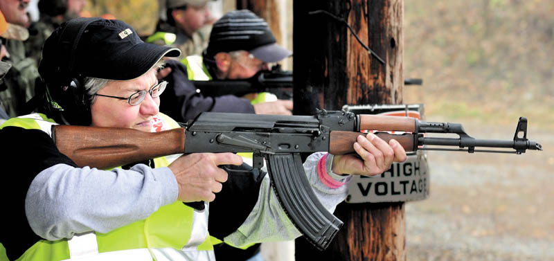 Veteran Sandra Smith takes aim at targets with an automatic weapon during the Maine Wounded Warrior Shoot Out in Anson on Sunday. The event drew awareness and support for veterans that suffered injuries in the service.