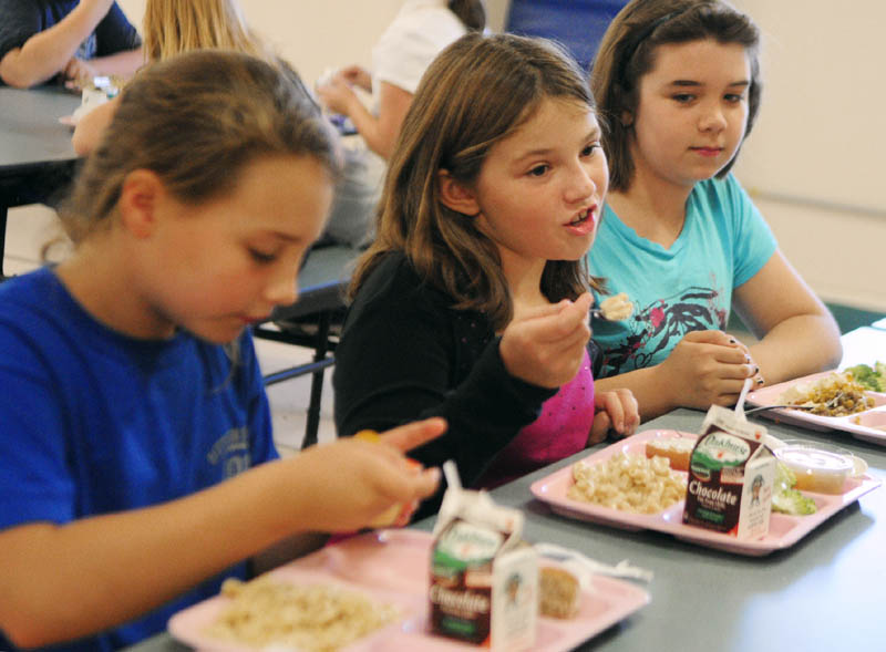 Students Lani Porter, left, Alyssa Price and Hanna Anderson talk about school lunch during an interview last week at Pittston Consolidated School.