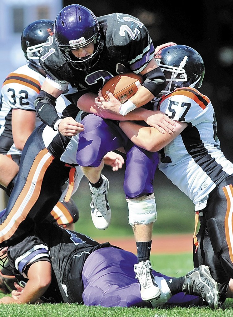 BIG GAME: Racean Wood, center, and the Waterville football team face Hampden Academy in a Pine Tree Conference Class B quarterfinal game tonight.