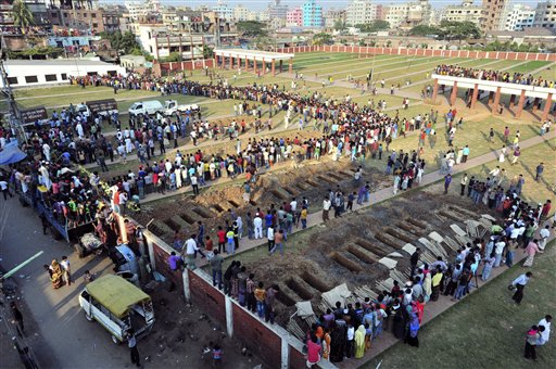 Bangladeshis prepare on Tuesday to bury the bodies of some of the victims of Saturday's fire in a garment factory in Dhaka, Bangladesh.