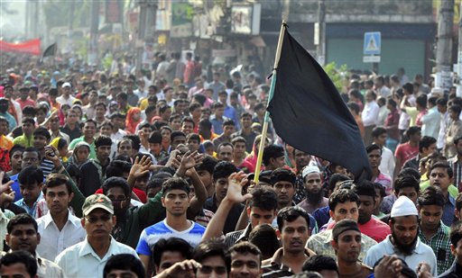 Bangladeshi garment workers march in protest on Tuesday to mourn the victims of Saturday's fire in a garment factory on the outskirts of Dhaka. Bangladesh held a day of mourning for the 112 people killed in the weekend fire, and labor groups planned more protests to demand better worker safety in an industry notorious for operating in firetraps.