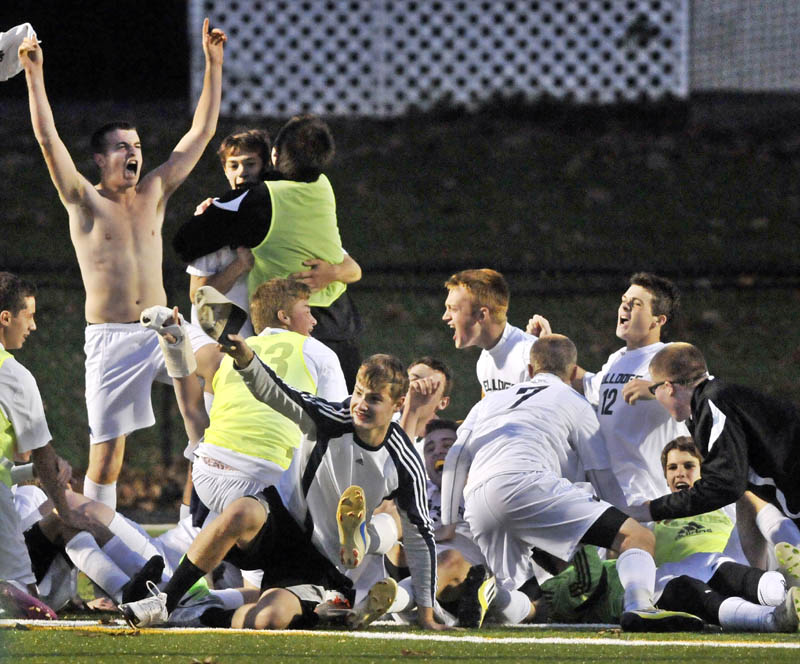 REASON TO SHOUT: Hall-Dale High School celebrates after beating Waynflete in the Western Maine Class C boys soccer championship game Thurday at Thomas College in Waterville. The Bulldogs won 1-0, beating the Flyers in a penalty kick shootout.