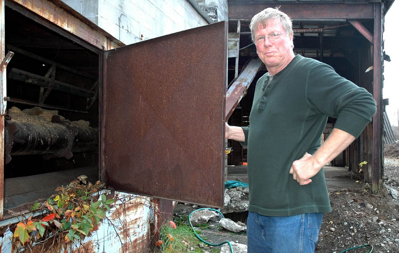 Jay Strickland of Bingham recently purchased the Kennebec Mill. He plans to open a sandblasting and equipment repair business in the former mill. Here, he takes a look inside the silo on the property.