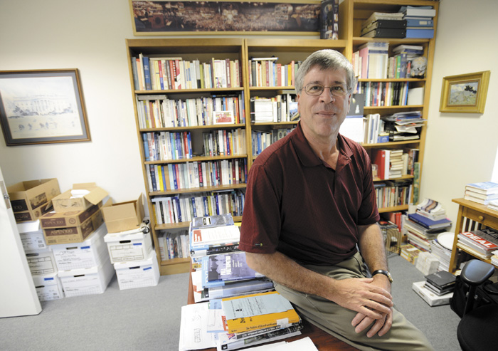 Staff Photo by Shawn Patrick Ouellette: Anthony Corrado, well known expert on the subject of campaign finance in his office at Colby College in Waterville Tuesday, July 24, 2012.