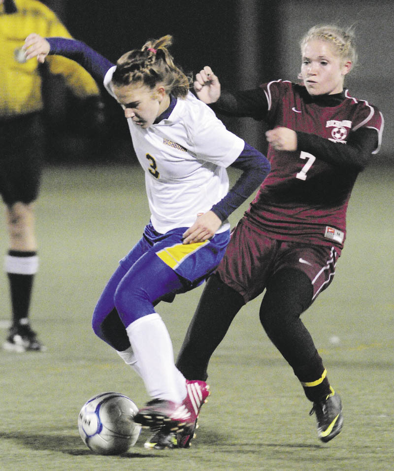 GIVE ME THAT: Washburn’s Carmen Bragg, left, and Richmond’s Sadie Gosse battle for a ball during the Class D state championship game Saturday night at Hampden Academy.