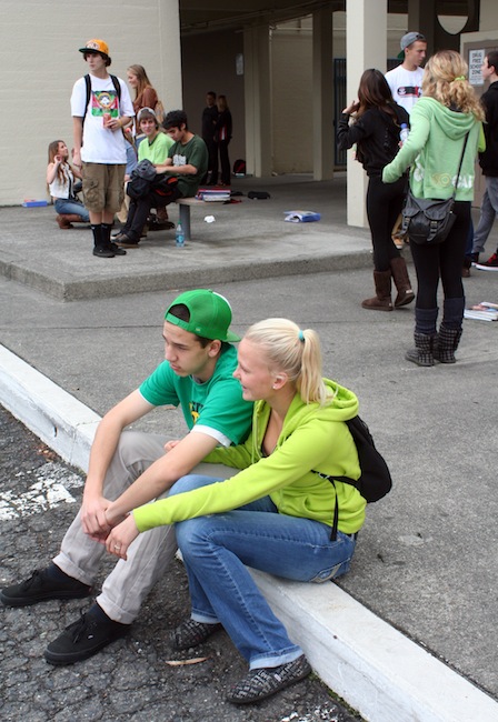 In this photo provided by the Arcata High School Pepperbox, Arcata High School students wear green colored clothing in tribute to fellow student Gregory Kulijan Monday, Nov. 26, 2012, at Arcata High School in Arcata, Calif. The Kuljian family were out for a walk Saturday, Nov. 24 at Big Lagoon beach, playing fetch with their dog when Gregory Kuljian tossed a stick that took their dog down to the water's edge. Kuljian's son ran to save the dog, and struggled as he was captured by the surging surf. Howard Kuljian followed, and later his wife. Both parents' bodies were later recovered, but the boy, presumed dead, is still missing. (AP Photo/Arcata High School Pepperbox, Forrest Lewis)