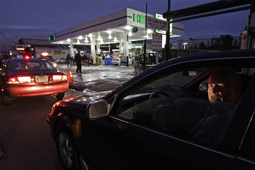 David Kahana, who said he had been sitting in line for an hour and 40 minutes, waits to purchase gasoline in Brooklyn on Thursday.