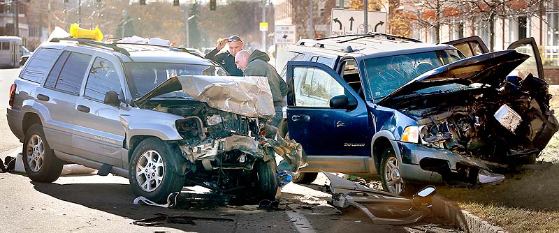 Members of the Portland Police Department investigate a two-car accident on Marginal Way in Portland on Sunday. According to the Portland Police Department there were numerous injuries.