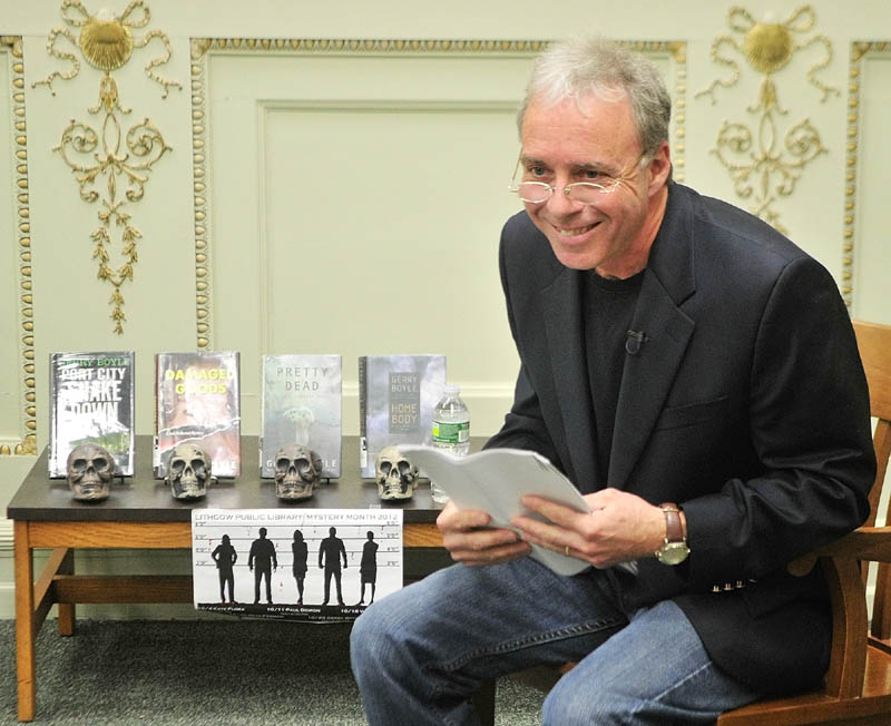 Crime fiction writer Gerry Boyle reads from his upcoming Jack McMorrow novel during a recent event in the reading room at Lithgow Public Library in Augusta.