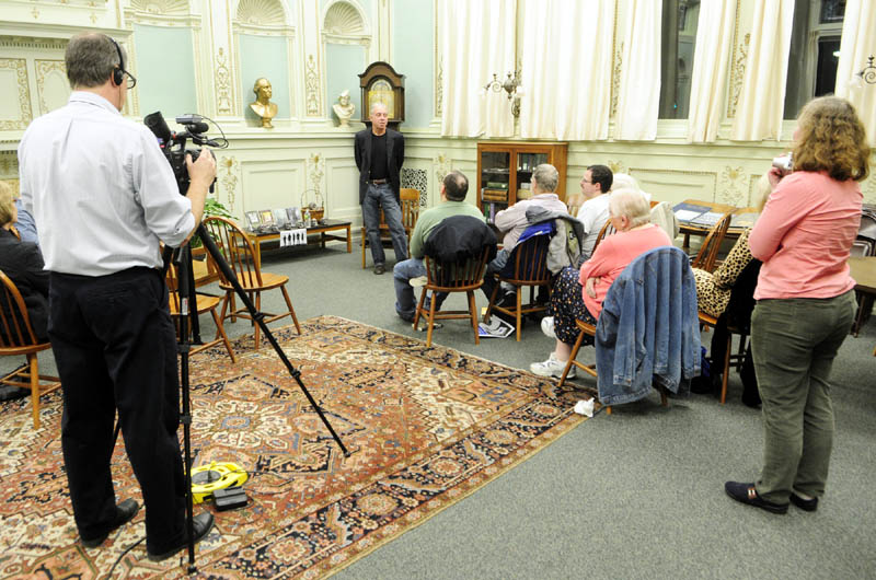 Crime fiction writer Gerry Boyle reads from his upcoming Jack McMorrow novel during a recent event in the reading room at Lithgow Public Library in Augusta.