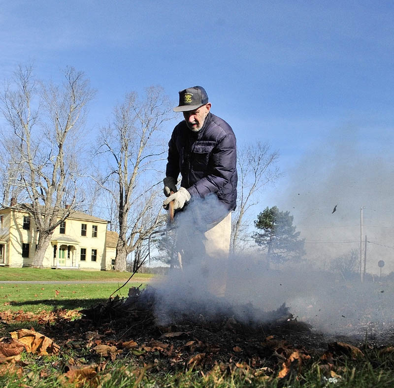 Herbert Wave burns brush on a cool and sunny Thursday afternoon near his Winthrop home.