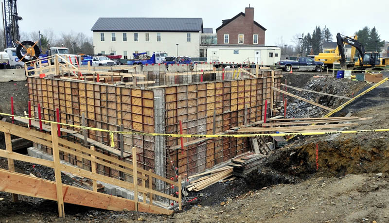 Workers construct the new science building on the Colby College campus on Thursday.