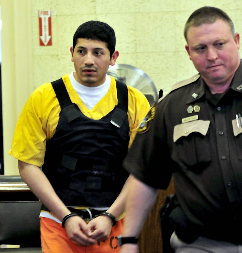 Juan Contreras is led into Franklin County Superior Court in Farmington Monday, the first day of his trial in the stabbing death of Grace Burton.