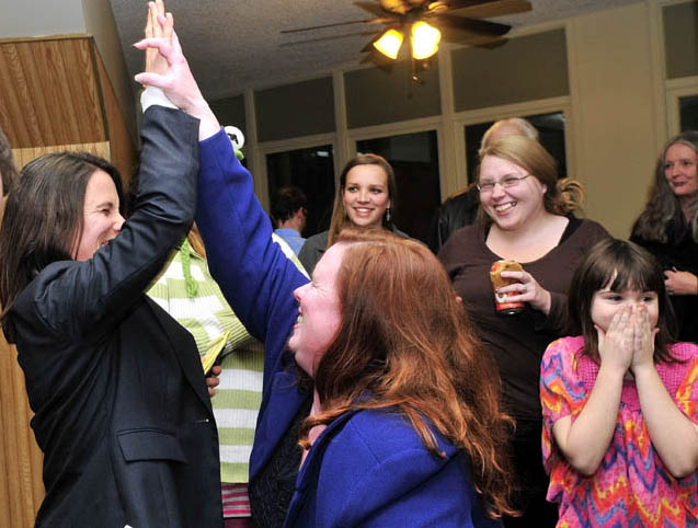 District Attorney candidate Maeghan Maloney, left, and Senate District 25 candidate Colleen Lachowicz react with joy following the closing of Waterville's polls on Tuesday.