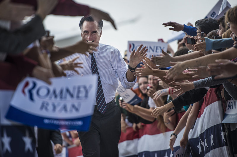 Republican presidential candidate Mitt Romney campaigns in Sanford, Fla., on Monday before heading to Virginia, Ohio and New Hampshire on the eve of the election.