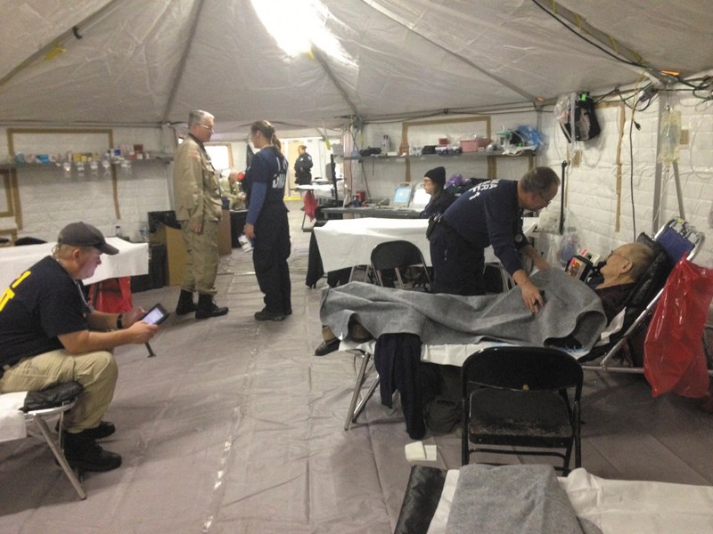 Members of the NH-1 Disaster Medical Assistance Team are operating a medical shelter for about 200 victims of Superstorm Sandy on the campus of Lehman College in the Bronx.