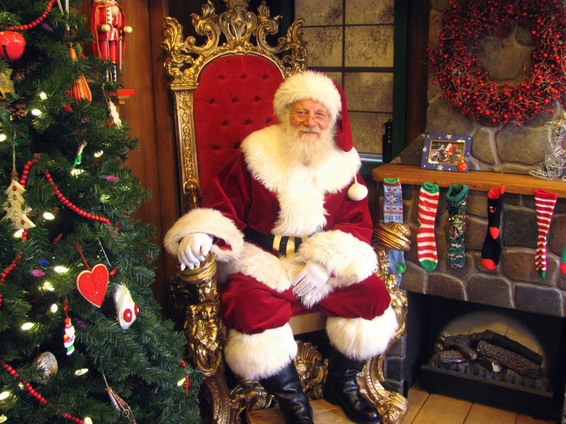 Santa Claus, a.k.a. Rob Hoffman, of Rangeley, gets ready to greet hundreds of children expected to visit Santa's Workshop on Friday, at President's park in Washington, D.C. Hoffman, a retired airline pilot who has moonlighted as Santa for eight years, landed the gig to sit in for Santa for most of December at the holiday display on The Ellipse, near the National Christmas Tree.