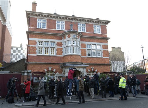 A policeman stands on duty outside as media gather at Westminster Coroner's Court where the initial inquest into nurse Jacintha Saldanha's death was opened Thursday.