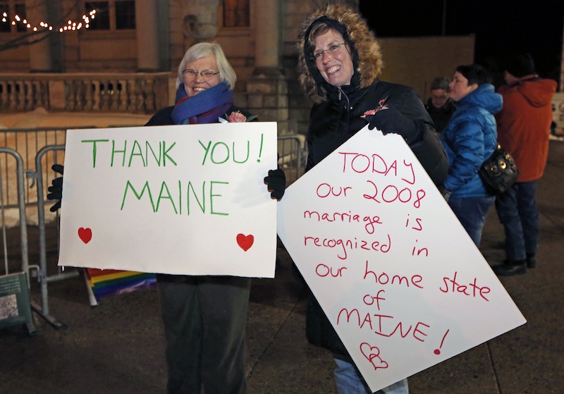 Lucie Bauer, left, and Annie Kiermaier, of Rockport, Maine, celebrate the imminent recognition of their marriage in their home state, Friday, Dec. 28, 2012, in Portland, Maine. The couple was married in California in 2008. Same-sex couples in Maine will be allowed to marry as a new law goes into effect at 12:01 a.m. Saturday, Dec. 29. (AP Photo/Robert F. Bukaty)
