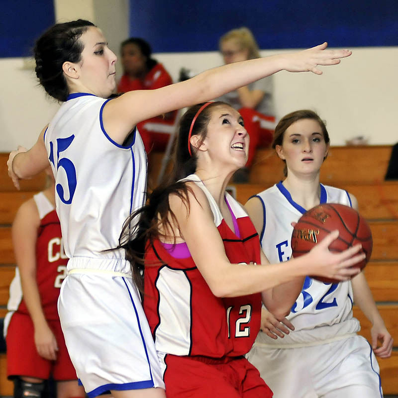 PLAYING D: Erskine Academy’s Mia Taylor, left, Mikaylah Cloutier attempt to block a shot by Cony High School’s Bayleigh Logan during the Rams’ 60-40 win on Thursday in South China.