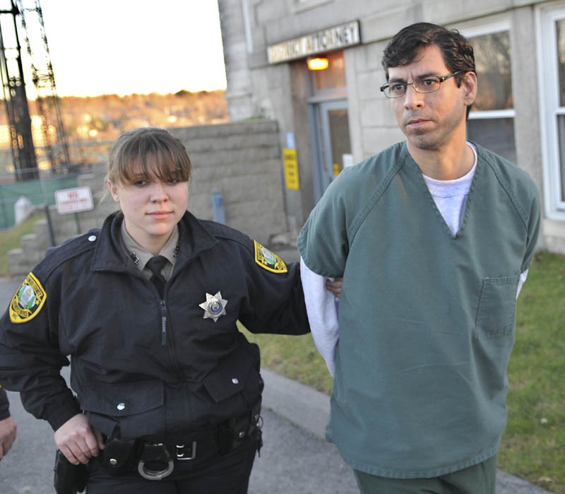 Michael Young, 41, is escorted to jail Thursday, after pleading guilty to manslaughter at Kennebec County Superior Court for the June 2011 stabbing of his domestic partner, David Cox,in Augusta.