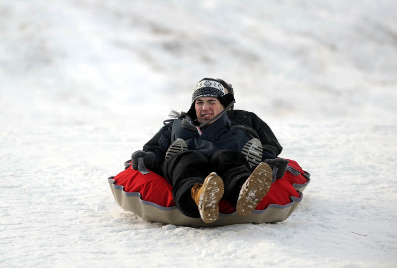 Matthew Wood,17, of Boston, front, and Alex Juarez, 19, of Tempe, Ariz., cruise down the slope on opening day at Eaton Mountain Ski Area in Skowhegan on Friday.
