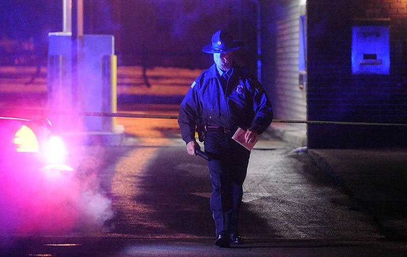 Skowhegan Police Chief Michael Emmons, emerges from the drive-through teller bay at Franklin Savings Bank on Madison Avenue in Skowhegan on Dec. 13, while investigating a robbery.