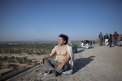 A man meditates from the top of the Pyramid of the Sun as the sun rises at the Teotihuacan archeological site in Teotihuacan in Mexico on Friday.