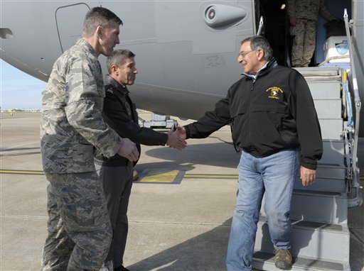 Defense Secretary Leon Panetta shakes hands with 10th Tanker Base Commander Brig. Gen Serdar Gulbas, center, Col. Christopher E. Craige, at left, Commander of the 39th Air Base Wing at Incirlik Air Base in Turkey on Friday.