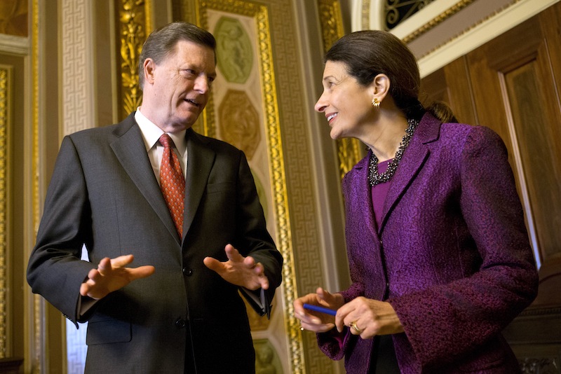 Snowe and McKernan chat after the senator gave her farewell speech in the Senate chamber Thursday.