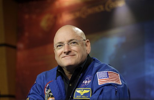 NASA astronaut Scott Kelley listens to a question about his scheduled 2015 mission aboard the International Space Station during a briefing Wednesday at Johnson Space Center in Houston.