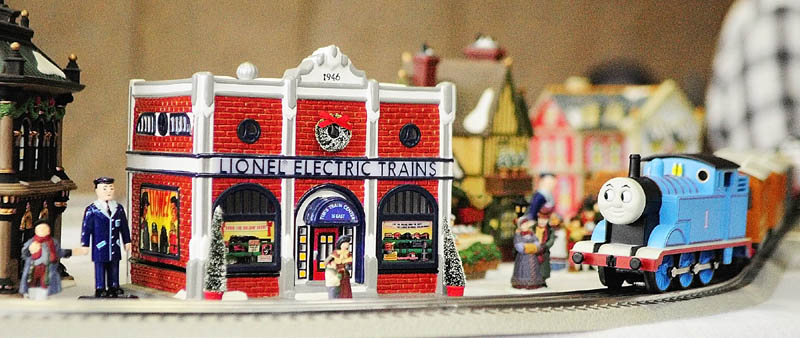A Thomas the Tank Engine model train runs through a Christmas time display on Friday at the Maine State Museum in Augusta.