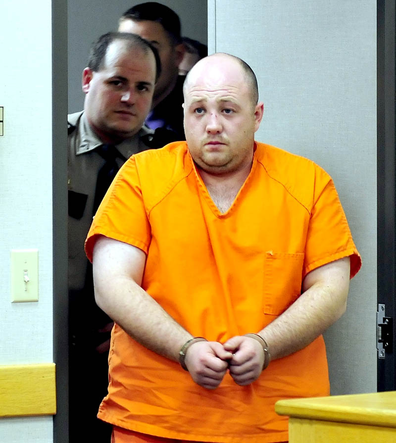 Matthew Partridge, of Winslow, is led into District Court in Waterville on Wednesday for an initial appearance in the shooting death of Justin Smith, of China, n Waterville late Tuesday evening.