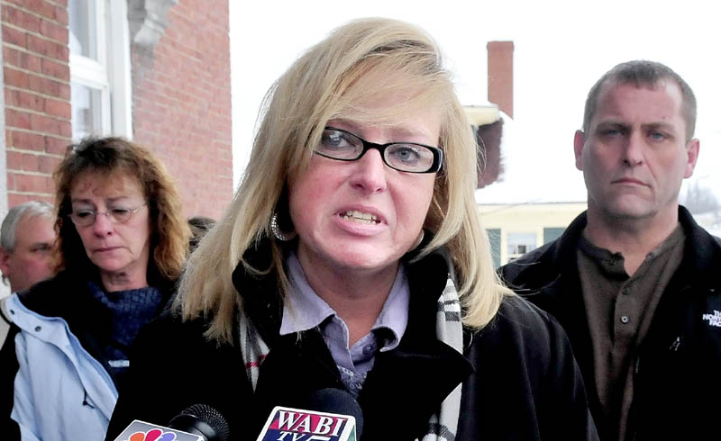 GUILTY: Murder defendant Robert Nelson, center, is flanked by his attorneys John Alsop, left, and Phil Mohlar before it was announced that he is guilty in the death of Everett L. Cameron in Somerset County Superior Court in Skowhegan on Tuesday, Dec. 18, 2012. State prosecutor Leane Zainea is in foreground.