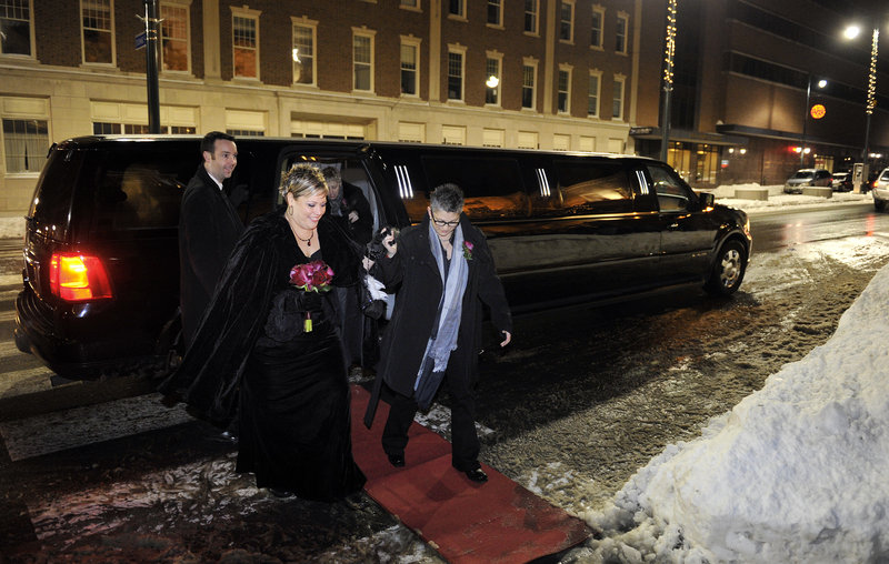 Lisa Gorney and Donna Galluzzo, both of Portland, arrive in style – complete with red carpet – at Portland City Hall late Friday night, shortly before the 12:01 a.m. moment Saturday when same-sex marriage would become legal in Maine. Supporters gathered outside cheered their arrival.