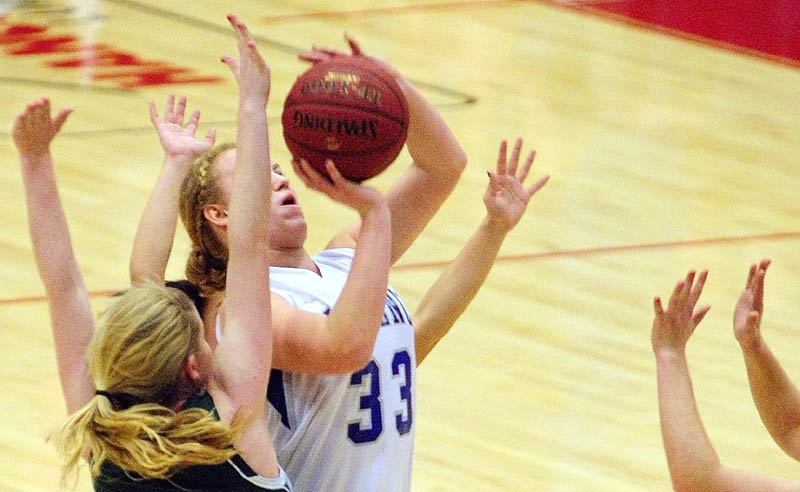 TAKE THE SHOT: Lawrence’s Nia Irving takes a shot under pressure during a Capital City Hoop Classic game on Saturday at the Augusta Civic Center.