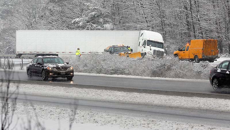 A tractor-trailer jackknifed across I-295 southbound just past Exit 17 in Yarmouth on Wednesday as a winter storm caused slippery roads throughout Maine.