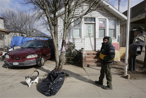 Eddie Saman walks to his home on Wednesday in the borough of Staten Island in New York. The house was badly damaged by Superstorm Sandy and will have to be renovated. Meanwhile, because of the extreme cold weather, Saman has been spending the night in a tent nearby operated by the volunteer group Cedar Grove Community Hub.