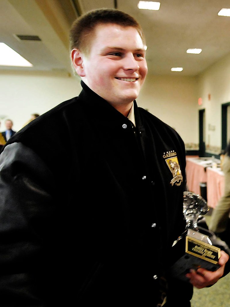 TAKING IT HOME: 2012 Gaziano Offensive Lineman award winner Bobby Begin holds his trophy during the awards ceremony Sunday in Augusta.