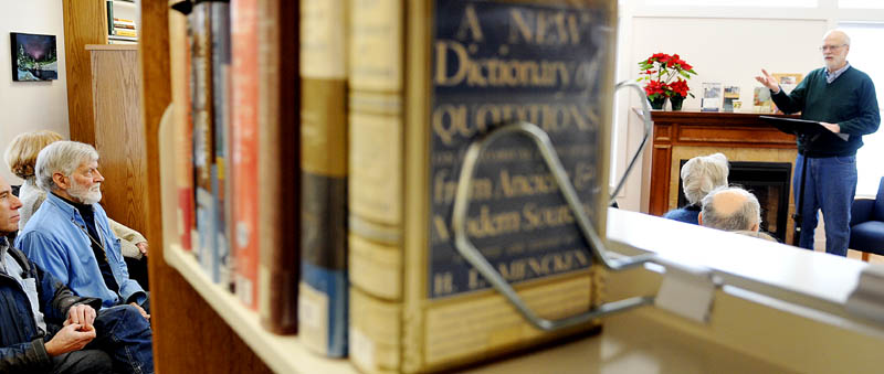 Wesley McNair, poet laureate of Maine, right, introduces his new memoir, "The Words I Chose," Sunday at the Belgrade Public Library. McNair read poems and discussed how his childhood influenced his vocation to a large audience of patrons at the library's new building.