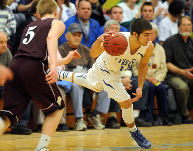 Lawrence High School's Spencer Carey, 14, makes the steal from Edward Little High School's Ian Mileikis, 5, in the third quarter in Fairfield Friday night.